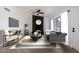 This open living room features a modern fireplace and large windows for natural light at 907 W Laguna Dr, Tempe, AZ 85282