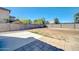 Large backyard features desert landscaping, block fence, and concrete patio, ready for customization at 9230 N 82Nd Ln, Peoria, AZ 85345