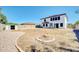 This backyard has a storage shed and a circular fire pit at 9230 N 82Nd Ln, Peoria, AZ 85345