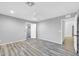 Bedroom featuring vinyl floors, ceiling fan, and ensuite bathroom with a walk-in closet at 9230 N 82Nd Ln, Peoria, AZ 85345