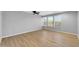 Empty bedroom showcasing vinyl floors, neutral walls, and natural light from the windows at 9230 N 82Nd Ln, Peoria, AZ 85345