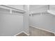 This closet features white shelves and gray walls and carpeted floors at 9230 N 82Nd Ln, Peoria, AZ 85345