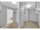 This closet features white shelves and gray walls and carpeted floors at 9230 N 82Nd Ln, Peoria, AZ 85345
