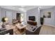 Living room boasts a sliding glass door, neutral color scheme, and ample seating at 9230 N 82Nd Ln, Peoria, AZ 85345