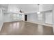 Living room featuring laminate flooring, neutral paint, a ceiling fan, and lots of natural light at 9230 N 82Nd Ln, Peoria, AZ 85345