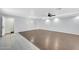 Living room featuring tile and laminate floors, neutral paint, and recessed lighting at 9230 N 82Nd Ln, Peoria, AZ 85345