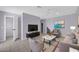 Well-lit living room with a neutral color palette and lots of seating at 9230 N 82Nd Ln, Peoria, AZ 85345