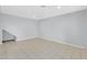 This living room features neutral paint and tile flooring at 9230 N 82Nd Ln, Peoria, AZ 85345