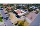 An aerial view of the property with an inviting pool, cabana and sports court at 10365 E Paradise Dr, Scottsdale, AZ 85260