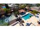 An aerial view of a resort-style backyard, with a pool, spa, cabana and basketball court at 10365 E Paradise Dr, Scottsdale, AZ 85260