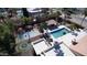 A resort-style backyard including a pool, cabana, basketball court and an in-ground trampoline at 10365 E Paradise Dr, Scottsdale, AZ 85260