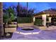 Backyard oasis with a sunken hot tub and a covered patio offering a relaxing outdoor retreat at 10365 E Paradise Dr, Scottsdale, AZ 85260
