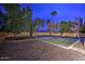 Private backyard basketball court with lush landscaping offers a great space for recreation at 10365 E Paradise Dr, Scottsdale, AZ 85260