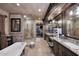 Luxury bathroom with standalone tub, glass shower, double vanity, and beautiful tile work at 10365 E Paradise Dr, Scottsdale, AZ 85260