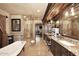 Spa-like bathroom featuring a soaking tub and glass-enclosed shower at 10365 E Paradise Dr, Scottsdale, AZ 85260