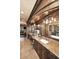 Elegant bathroom with granite counters, custom cabinets, and chandeliers at 10365 E Paradise Dr, Scottsdale, AZ 85260
