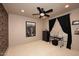 Bedroom featuring a black ceiling fan, decorative wall art, and modern furnishings at 10365 E Paradise Dr, Scottsdale, AZ 85260