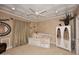 Charming bedroom with a decorative ceiling, patterned daybed, and elegant decor at 10365 E Paradise Dr, Scottsdale, AZ 85260