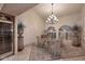 Elegant dining room featuring vaulted ceilings, custom chandelier, and a wine fridge ready for your next event at 10365 E Paradise Dr, Scottsdale, AZ 85260