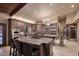 Spacious kitchen with two islands, custom wood cabinets, granite countertops, and stainless steel appliances at 10365 E Paradise Dr, Scottsdale, AZ 85260