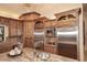 Gourmet kitchen boasts stainless steel appliances and granite countertops at 10365 E Paradise Dr, Scottsdale, AZ 85260