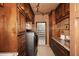 Laundry room offers cabinetry, stone countertops, and modern appliances at 10365 E Paradise Dr, Scottsdale, AZ 85260