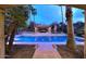 Backyard pool and spa with a gazebo-covered dining area provides a perfect space for relaxation and entertainment at 10365 E Paradise Dr, Scottsdale, AZ 85260