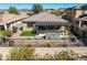 An aerial view showcases the private backyard, covered patio, and manicured landscaping at 10635 W Eucalyptus Rd, Peoria, AZ 85383