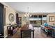Elegant dining area with a chandelier, stylish furnishings, and sliding door access to the backyard at 10635 W Eucalyptus Rd, Peoria, AZ 85383