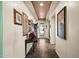 Inviting entryway with tiled floors, decorative table, and ornate framed art leading to the front door at 10635 W Eucalyptus Rd, Peoria, AZ 85383