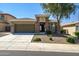 Charming single-story home featuring stone accents, a well-manicured yard, and a spacious two-car garage at 10635 W Eucalyptus Rd, Peoria, AZ 85383