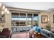 Open living space featuring sliding glass doors that lead to a scenic backyard patio with a stone water feature at 10635 W Eucalyptus Rd, Peoria, AZ 85383