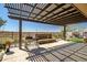 Inviting covered patio with grill, water feature, and mountain views at 10635 W Eucalyptus Rd, Peoria, AZ 85383