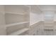 Walk-in closet featuring custom shelves, rods, and durable floors providing ample storage and organization at 11142 E Copper Dust Trl, Florence, AZ 85132