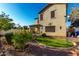 Backyard featuring an exterior view of the home, landscaped yard, and outdoor seating at 11713 W Tonto St, Avondale, AZ 85323