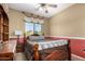 Bright bedroom features cozy carpet, wood-look furniture, and natural light at 11713 W Tonto St, Avondale, AZ 85323
