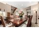 Open dining area showcasing an over-sized table, comfortable seating, and direct access to the living area at 11713 W Tonto St, Avondale, AZ 85323