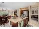 Open kitchen view showcases island with sink, stainless appliances, and adjacent dining area at 11713 W Tonto St, Avondale, AZ 85323