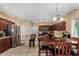 Open concept kitchen with breakfast bar, stainless steel appliances and dining area at 11713 W Tonto St, Avondale, AZ 85323