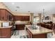 Well-equipped kitchen featuring a kitchen island, stainless steel appliances and ample counter space at 11713 W Tonto St, Avondale, AZ 85323