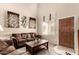Cozy living room with neutral carpet, high ceilings, and ample natural light at 11713 W Tonto St, Avondale, AZ 85323