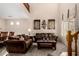 Comfortable living room with cathedral ceilings, plush seating, and large windows at 11713 W Tonto St, Avondale, AZ 85323