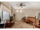 Upstairs loft area features large windows, neutral walls, and a cozy chair at 11713 W Tonto St, Avondale, AZ 85323