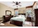 Cozy main bedroom features carpet, ceiling fan, and coordinated furniture set at 11713 W Tonto St, Avondale, AZ 85323
