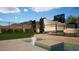 Stylish backyard with in ground pool and seating area with desert landscaping and privacy fence at 12328 E Black Rock Rd, Scottsdale, AZ 85255