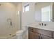 Stylish bathroom with walk-in glass shower, modern fixtures, vanity, and tiled surround at 12328 E Black Rock Rd, Scottsdale, AZ 85255