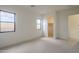 Spacious, light-filled bedroom with multiple windows and access to a walk-in closet at 12328 E Black Rock Rd, Scottsdale, AZ 85255