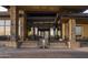 Elegant entryway with stone columns, a water feature, and glass doors leading to the interior at 12328 E Black Rock Rd, Scottsdale, AZ 85255