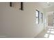 Bright hallway with natural light through several windows and neutral walls at 12328 E Black Rock Rd, Scottsdale, AZ 85255