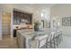 Spacious kitchen with a large island, seating, stainless steel appliances, and stylish dark wood cabinetry at 12328 E Black Rock Rd, Scottsdale, AZ 85255